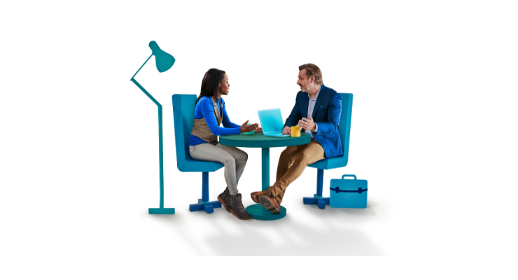 Photo of people talking at a a laptop